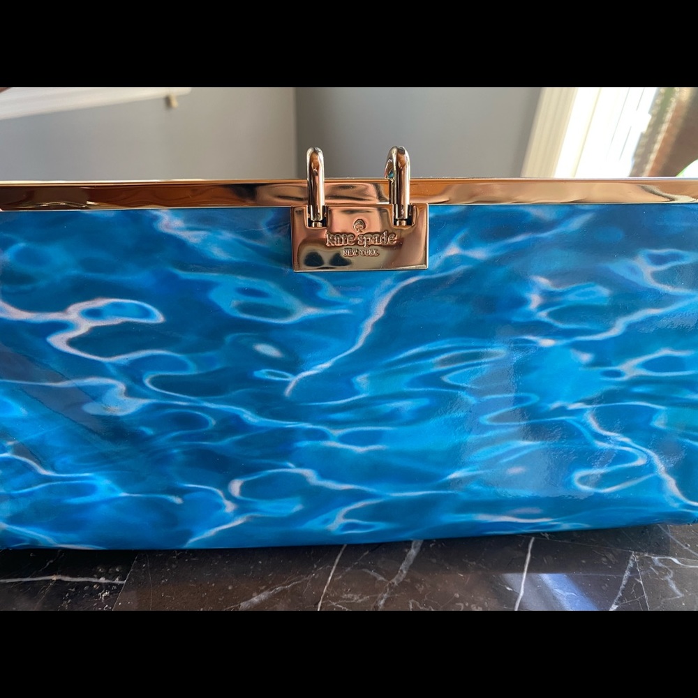 Brand New with tags! Kate Spade leather “pool” clutch with metal latter